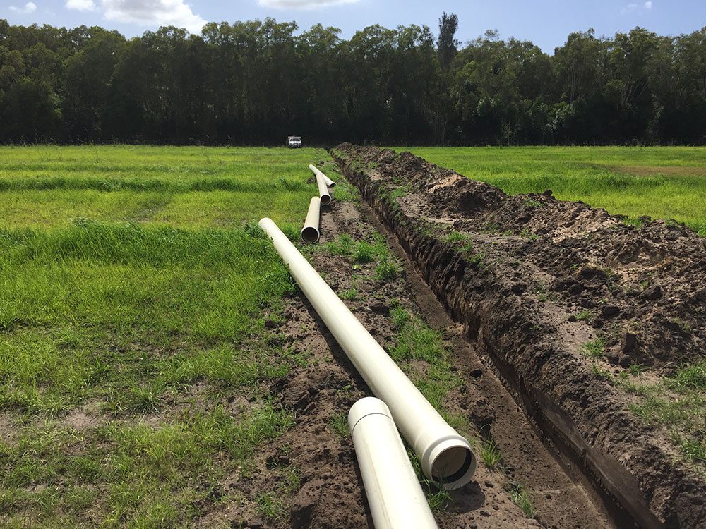 A couple of pipes in the middle of a field.