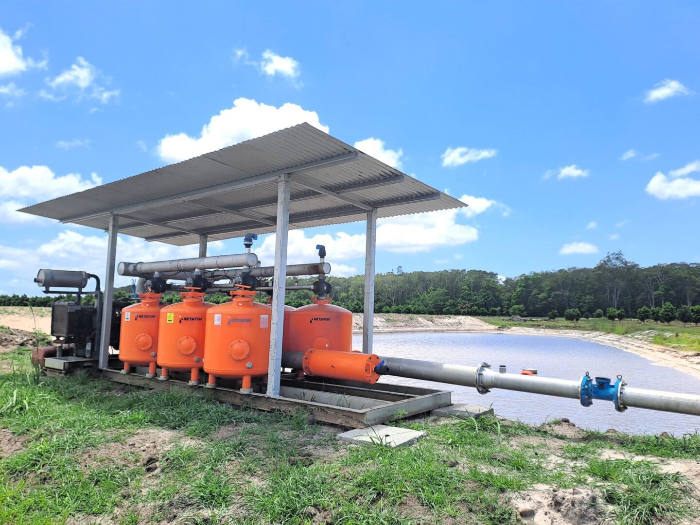 A group of orange tanks sitting next to each other.